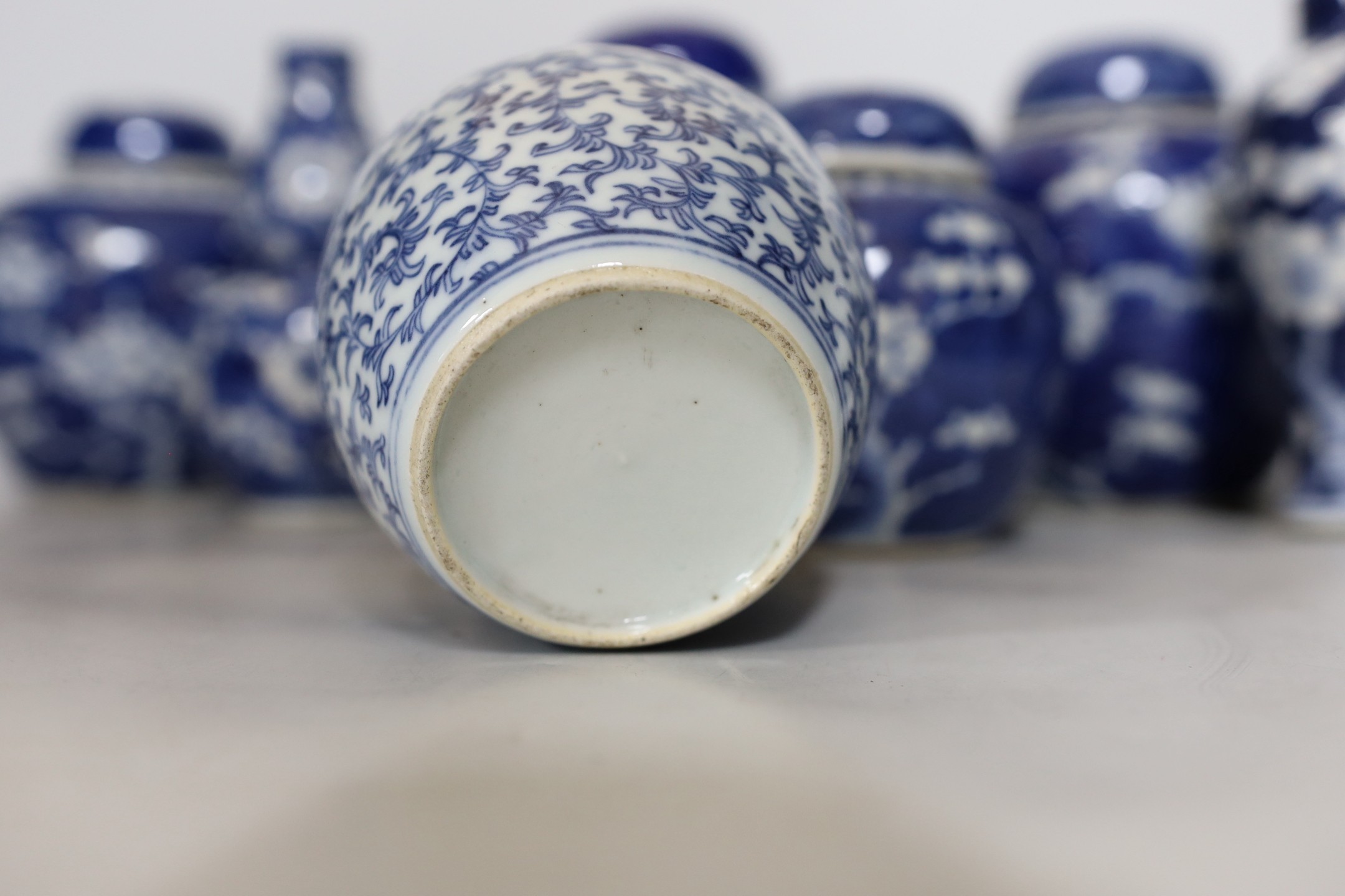 Four Chinese blue and white prunus pattern ginger jars, together with three similar vases. 19th/early 20th century, Tallest 15cm
